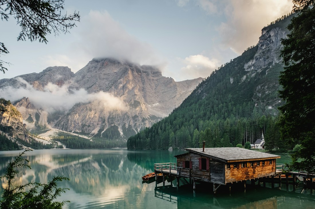 Illustrative photograph of mountains reflected in a lake